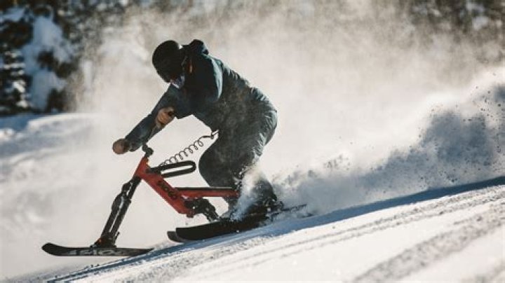 How do you stop on a snow bike?